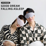 Two people wearing sleep masks with the text 'EYESHADE GOOD DREAM FALLING ASLEEP' on a light gray background.