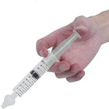 Hand holding a syringe with measurement markings on a white background