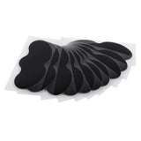Set of black adhesive patches on a white background