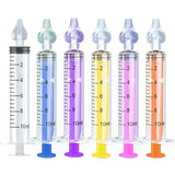 Set of six colorful syringes with measurement markings on a white background