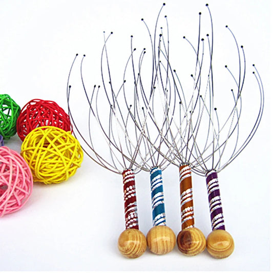 Set of scalp massagers with wooden handles and colorful yarn balls on a white background