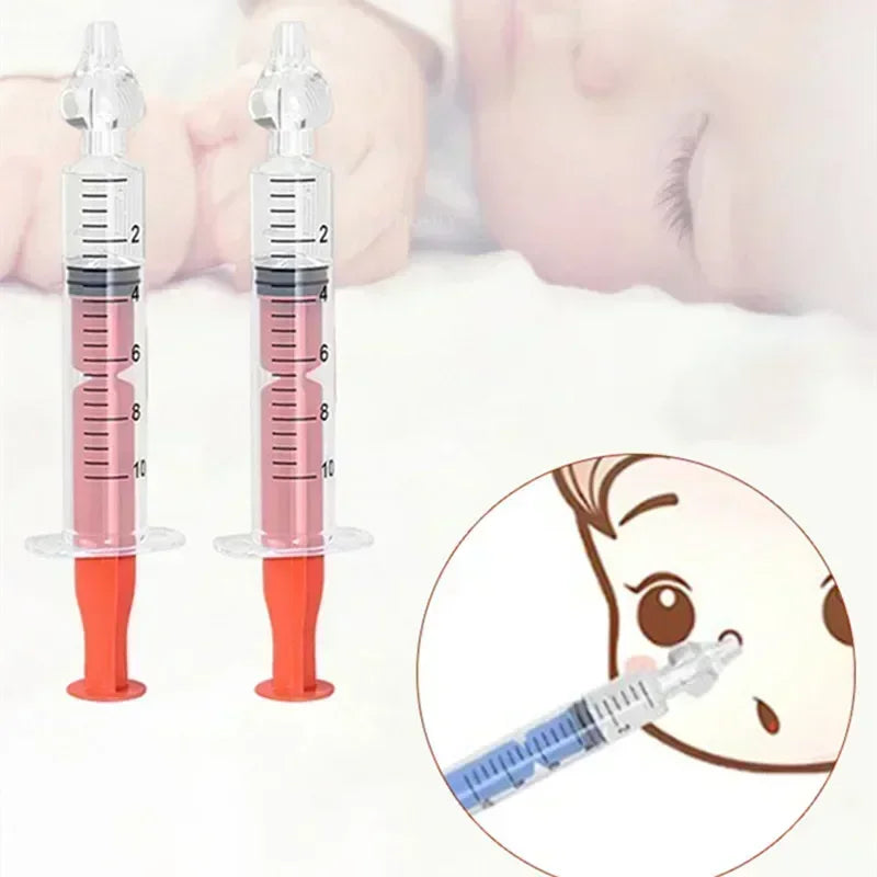 Two syringes with red liquid and a cartoon illustration of a child's face.