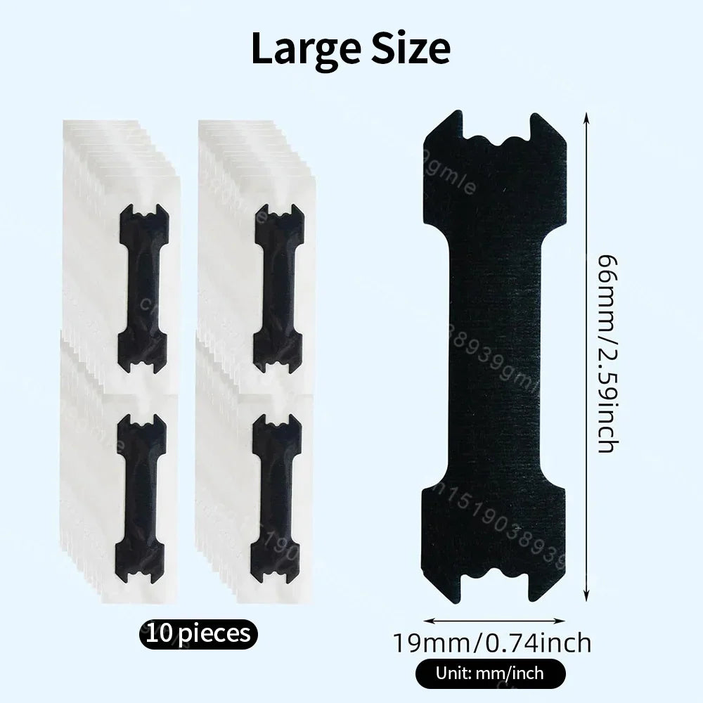 Set of black oscillating tool blades with packaging on a light blue background