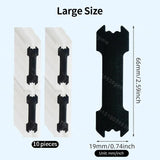 Set of black oscillating tool blades with packaging on a light blue background